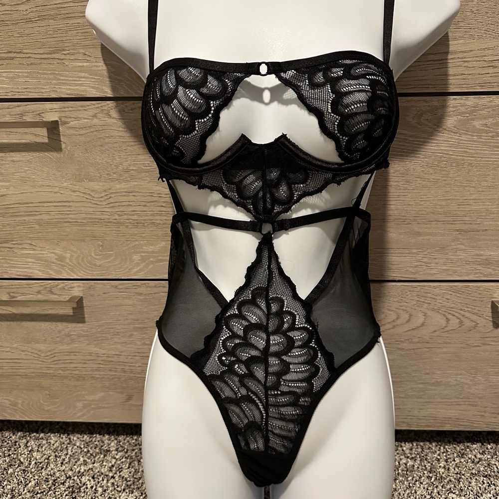 Black sheer and lace bodysuit. Size small.